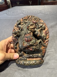 A Chinese bronze Guanyin, Ming and a Tibetan polychrome plaster relief, 19th C.