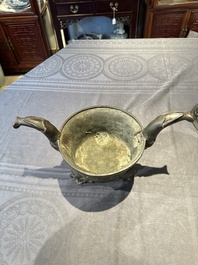 A Chinese bronze 'elephant' tripod censer and cover, Ming