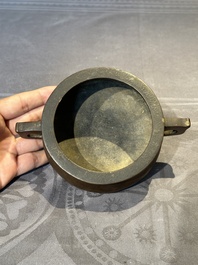 A Chinese bronze censer and stand, Xuande mark, 17th C.