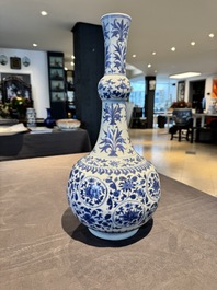 A Chinese blue and white 'lotus scroll' bottle vase, Transitional period