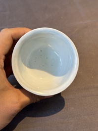 A Chinese blue and white stem cup with scholars in a landscape, Transitional period