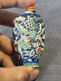 Five Chinese moulded famille rose snuff bottles, Qianlong mark, 19th C.