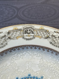 A Chinese bianco sopra bianco Belgian market armorial dish and a famille rose Dutch market armorial plate, Qianlong