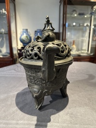 A Chinese bronze 'elephant' tripod censer and cover, Ming