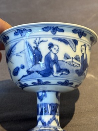 A Chinese blue and white stem cup with scholars in a landscape, Transitional period