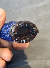 Five Chinese moulded famille rose snuff bottles, Qianlong mark, 19th C.