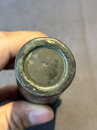 A Chinese bronze cylindrical 'cicada' flower arranging vase, Xuande mark, Ming