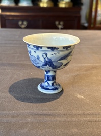 A Chinese blue and white stem cup with scholars in a landscape, Transitional period