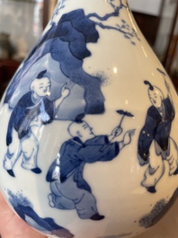 A Chinese blue and white bottle vase with court ladies and playing boys, Chenghua mark, Kangxi
