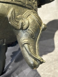 A Chinese bronze 'elephant' tripod censer and cover, Ming