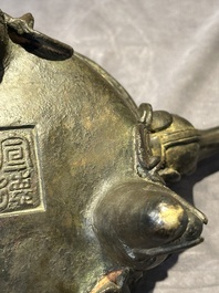 A Chinese bronze 'elephant' tripod censer and cover, Ming