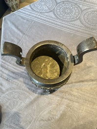 A large Chinese bronze censer and cover with a Buddhist lion, Ming