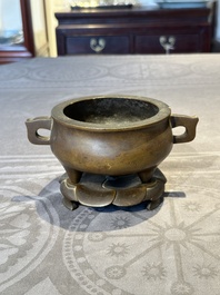 A Chinese bronze censer and stand, Xuande mark, 17th C.