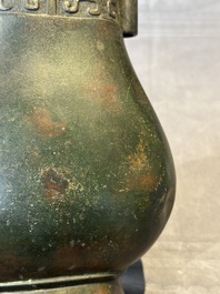 A Chinese silver-inlaid bronze arrow vase with Taotie design, 'touhu 投壺', Ming