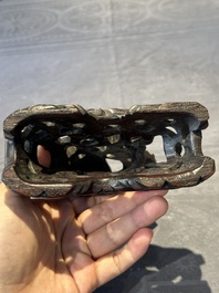 A Chinese buffalo horn carving of a landscape with a pagoda on wooden stand, Qing