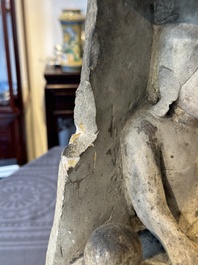 A Burmese limestone stele with Buddha and two attendants with traces of gilding, 19th C.