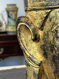 A Thai red sandstone head of Buddha and a lacquered and gilt stone head of Buddha, possibly Ayutthaya period, 15th C.