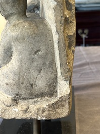 A Burmese limestone stele with Buddha and two attendants with traces of gilding, 19th C.