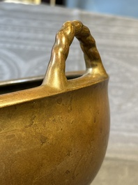 A large Chinese bronze tripod censer with two handles, 19th C.