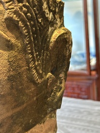 A Thai red sandstone head of Buddha and a lacquered and gilt stone head of Buddha, possibly Ayutthaya period, 15th C.