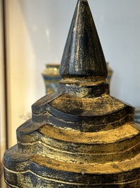 A Thai red sandstone head of Buddha and a lacquered and gilt stone head of Buddha, possibly Ayutthaya period, 15th C.