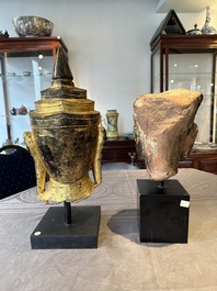 A Thai red sandstone head of Buddha and a lacquered and gilt stone head of Buddha, possibly Ayutthaya period, 15th C.