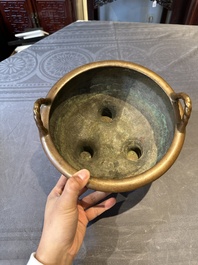 A large Chinese bronze tripod censer with two handles, 19th C.