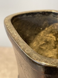 A pair of Chinese bronze 'hu' vases with Taotie design, Song/Yuan