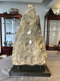 A Burmese limestone stele with Buddha and two attendants with traces of gilding, 19th C.