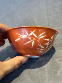 A Chinese coral-red-glazed bowl with reverse-decorated bamboo design, Xuantong mark and of the period
