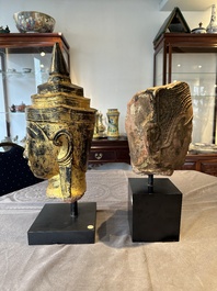 A Thai red sandstone head of Buddha and a lacquered and gilt stone head of Buddha, possibly Ayutthaya period, 15th C.