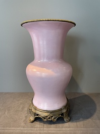 A large Chinese monochrome pink-glazed 'gu' vase with bronze mounts, 19/20th C.
