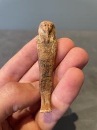A death mask, a Ushabti, an oil lamp and a ritual cone with hieroglyphs, Egypt, 15th/1st C. B.C.