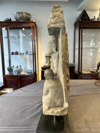 A Burmese limestone stele with Buddha and two attendants with traces of gilding, 19th C.