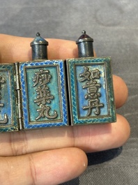 A pair of four-fold Chinese enamelled and engraved silver medicine bottles, 19th C.