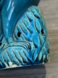 A pair of Chinese turquoise-glazed parrots, 19th C.