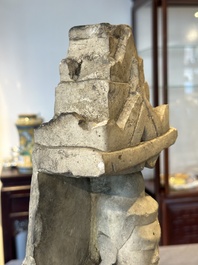 A Burmese limestone stele with Buddha and two attendants with traces of gilding, 19th C.