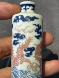 A Chinese blue, white and copper-red 'dragon' snuff bottle, 19th C.
