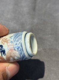 A Chinese blue, white and copper-red 'dragon' snuff bottle, 19th C.