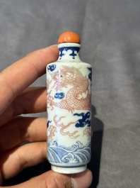 A Chinese blue, white and copper-red 'dragon' snuff bottle, 19th C.