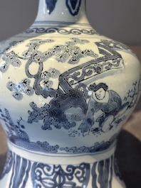 A blue and white Dutch Delft bottle-shaped chinoiserie vase with a lion, 17th C.