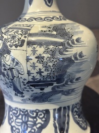 A blue and white Dutch Delft bottle-shaped chinoiserie vase with a lion, 17th C.