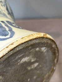 A blue and white Dutch Delft bottle-shaped chinoiserie vase with a lion, 17th C.