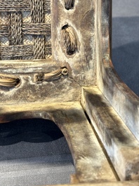A Chinese rectangular huanghuali wooden stool with 'chilong' design, 17/18th C.