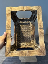 A Chinese rectangular huanghuali wooden stool with 'chilong' design, 17/18th C.