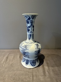 A blue and white Dutch Delft bottle-shaped chinoiserie vase with a lion, 17th C.