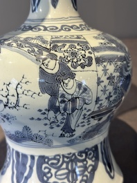 A blue and white Dutch Delft bottle-shaped chinoiserie vase with a lion, 17th C.