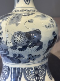 A blue and white Dutch Delft bottle-shaped chinoiserie vase with a lion, 17th C.
