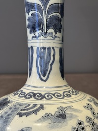 A blue and white Dutch Delft bottle-shaped chinoiserie vase with a lion, 17th C.