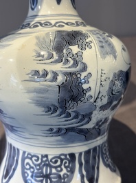 A blue and white Dutch Delft bottle-shaped chinoiserie vase with a lion, 17th C.